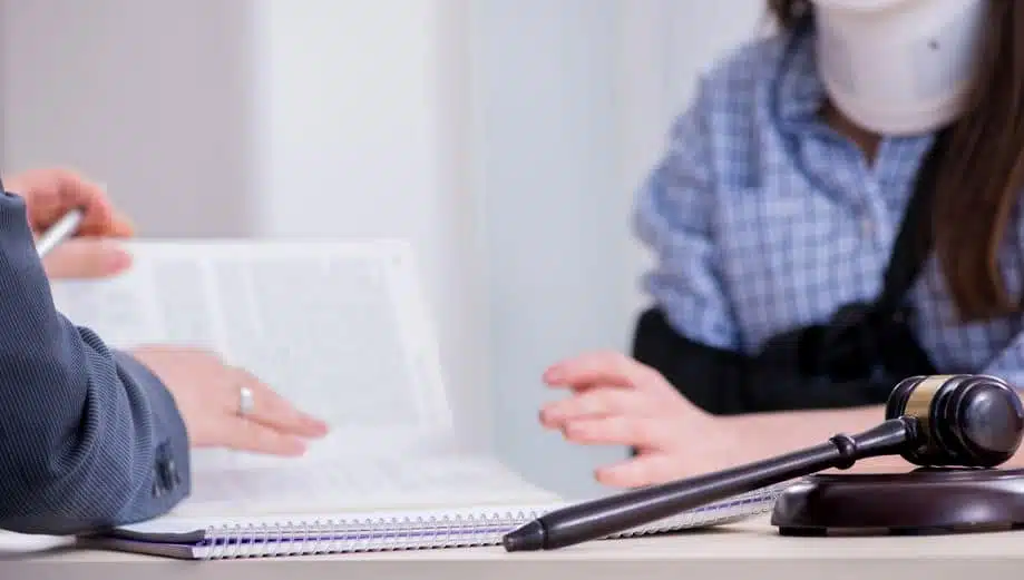woman discussing injury with lawyer