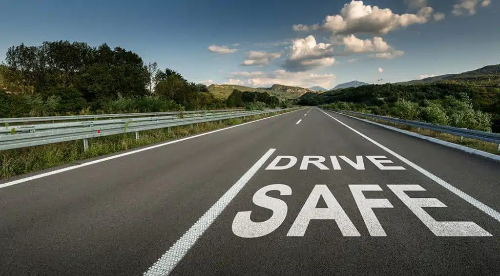 drive safe painted on highway