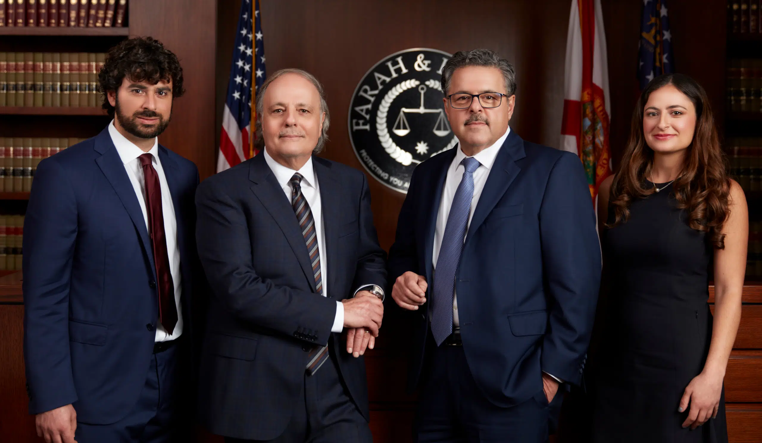 Group photo of Farah & Farah personal injury attorneys Chuck, Eddie, Dalya, and Khalil Farah