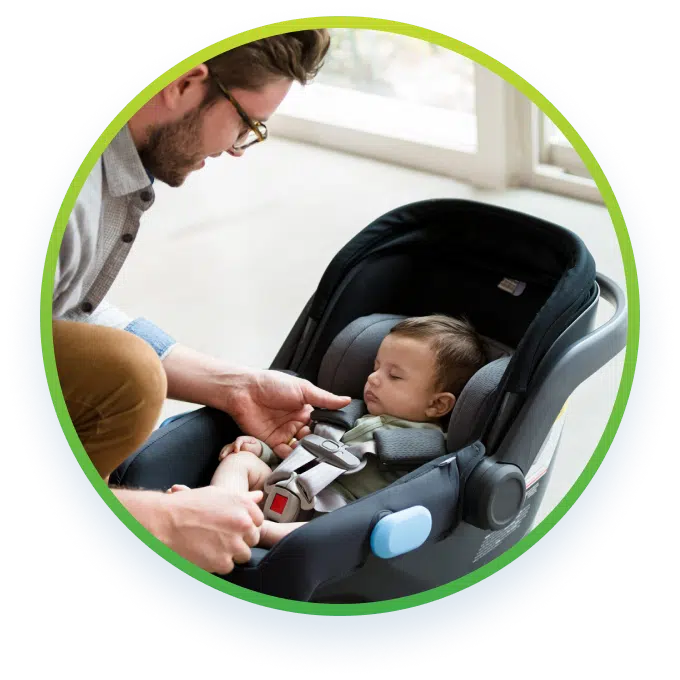 A man strapping a child on a child seat