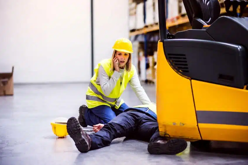 A factory lady calling 911 after a friend collapse