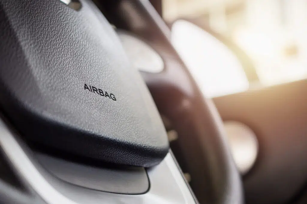 an image of a car steering wheel focused on the word airbag