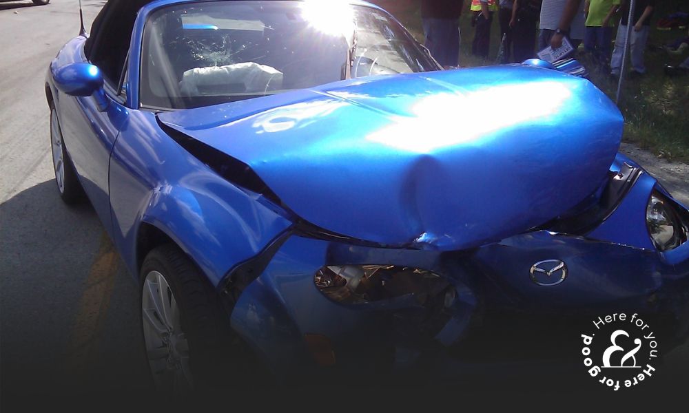 Blue car damaged after an accident