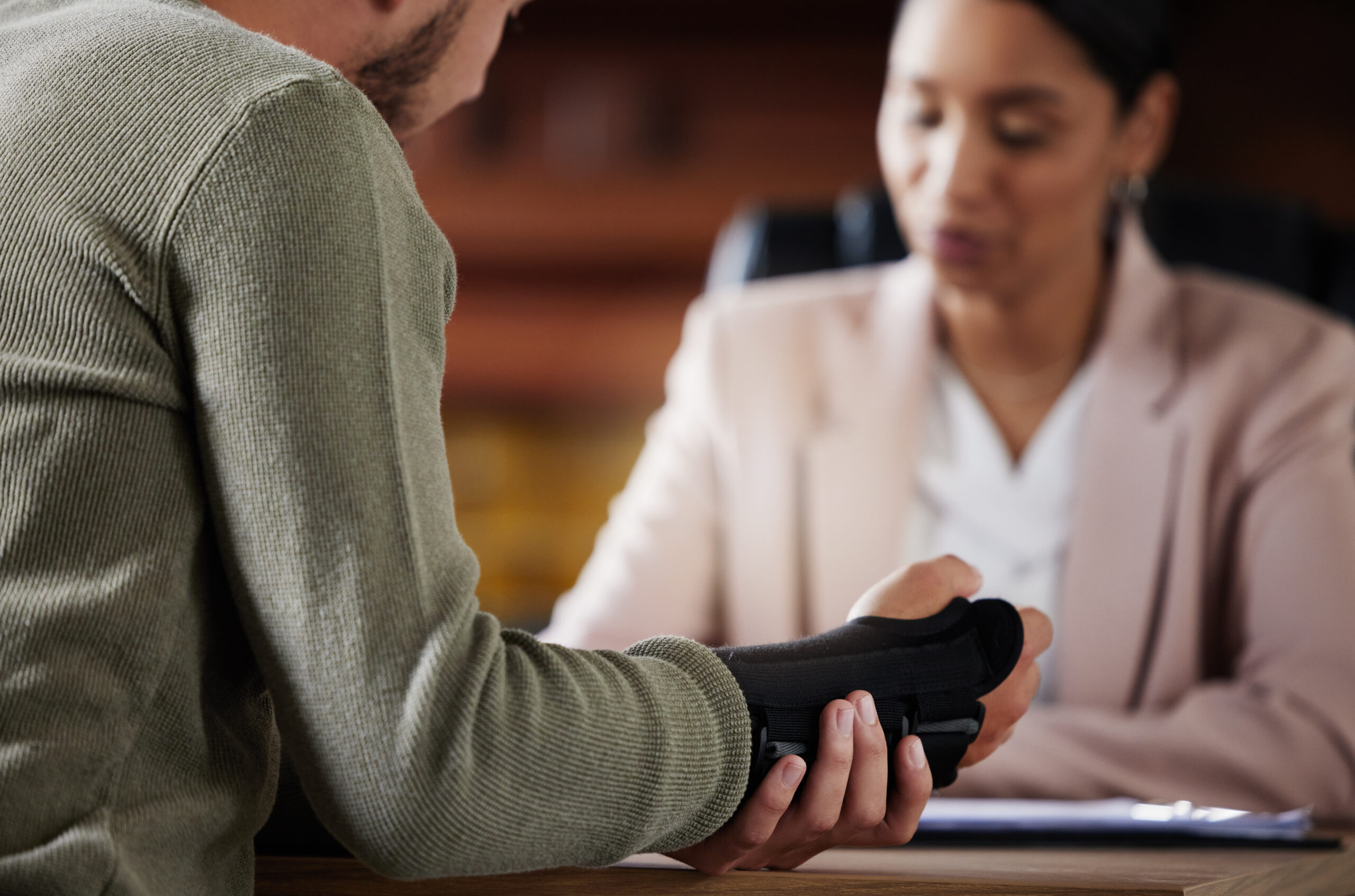 an injured person consulting with a personal injury attorney after an accident