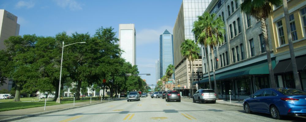 Street view of Jacksonville with cars driving on the road