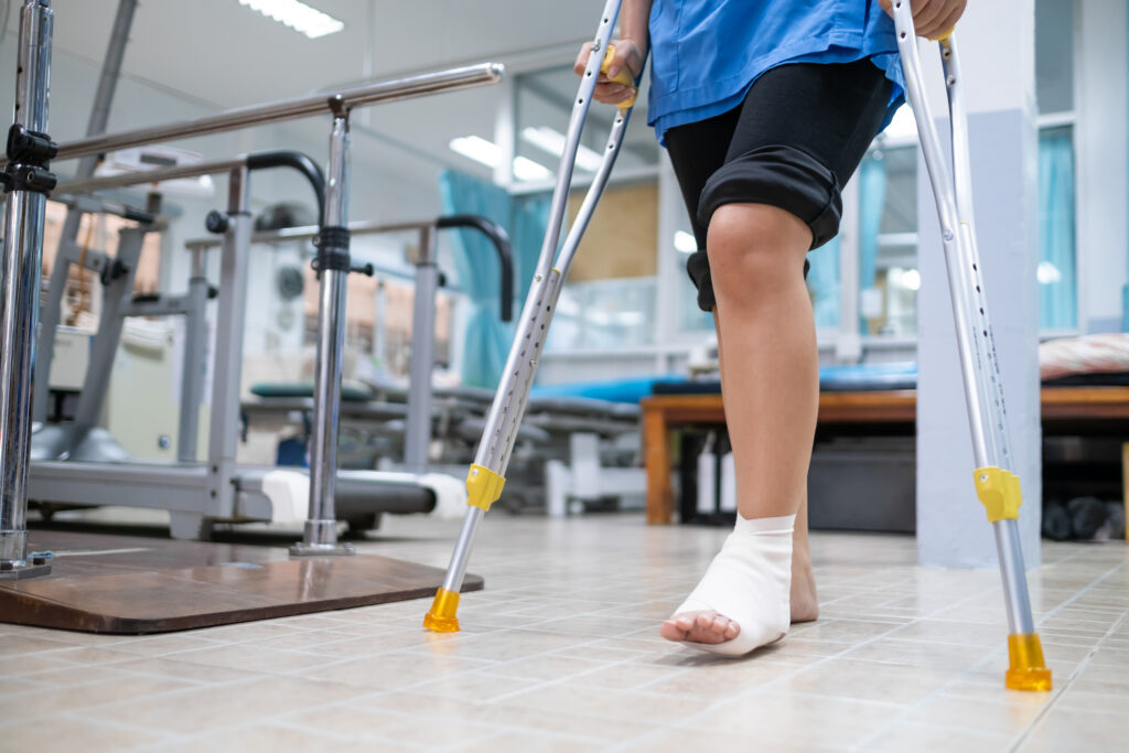 patient at a hospital with an injured foot in the physical therapy room of a hospital after an injury