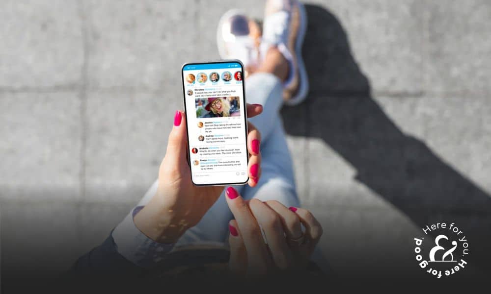 a woman making a social media post on a cell phone