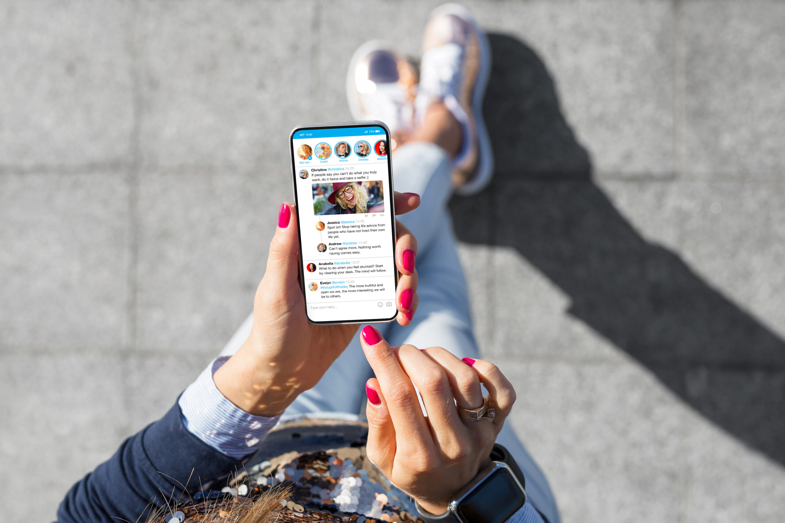 a woman making a social media post on a cell phone