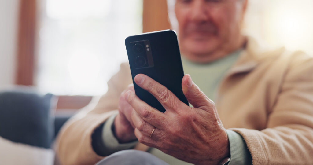 an elderly man posting on social media