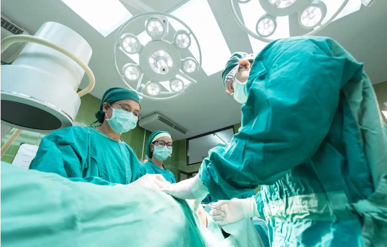 Group of surgeons operating a patient