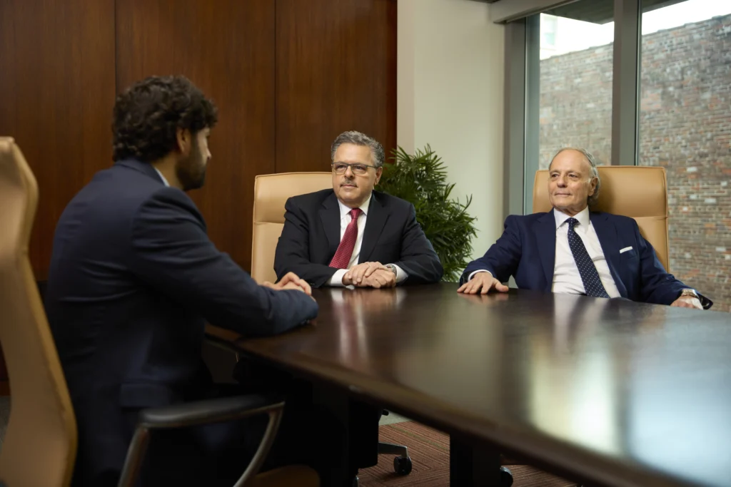 Farah attorneys talking in a conference room