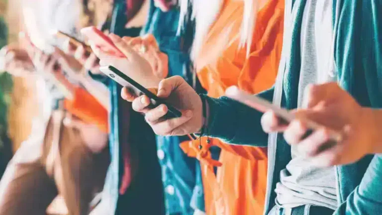 smartphones in the hands of teenagers using them