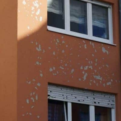 A building affected by a hailstorm