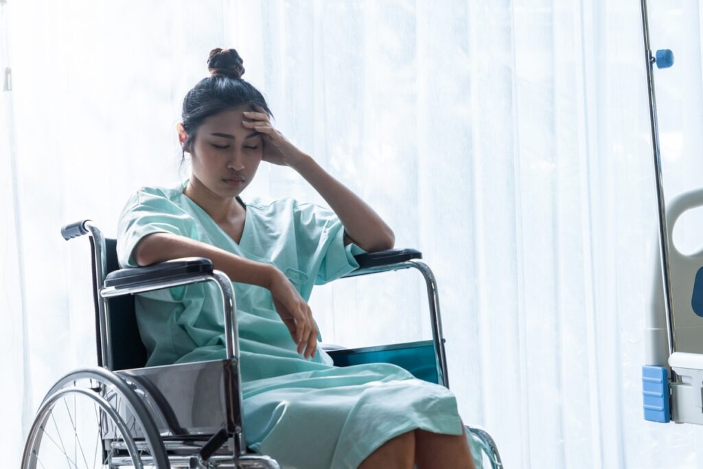 a sick lady sitting on a wheel chair