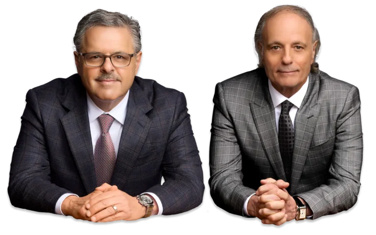personal injury attorneys Eddie and Chuck Farah smiling