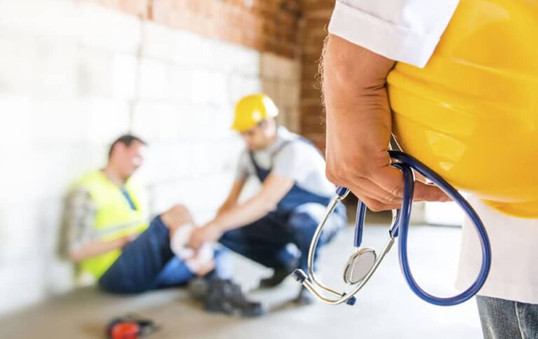a doctor approaching a slip and fall labourer