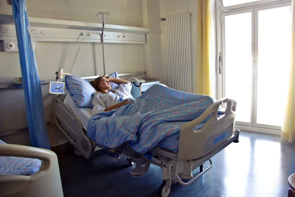 A woman laying in a hospital bed