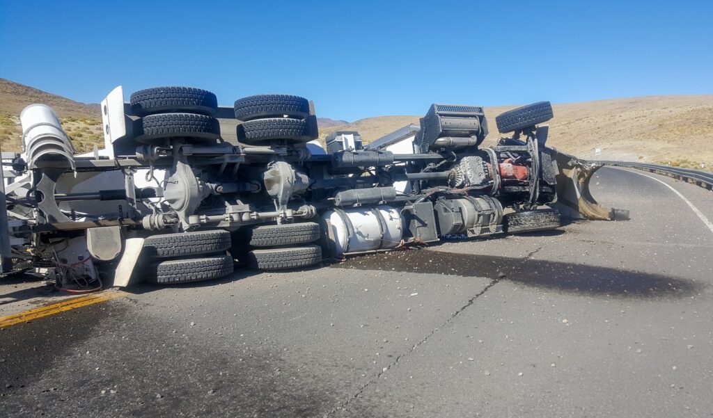 A tractor trailer flipped on its side