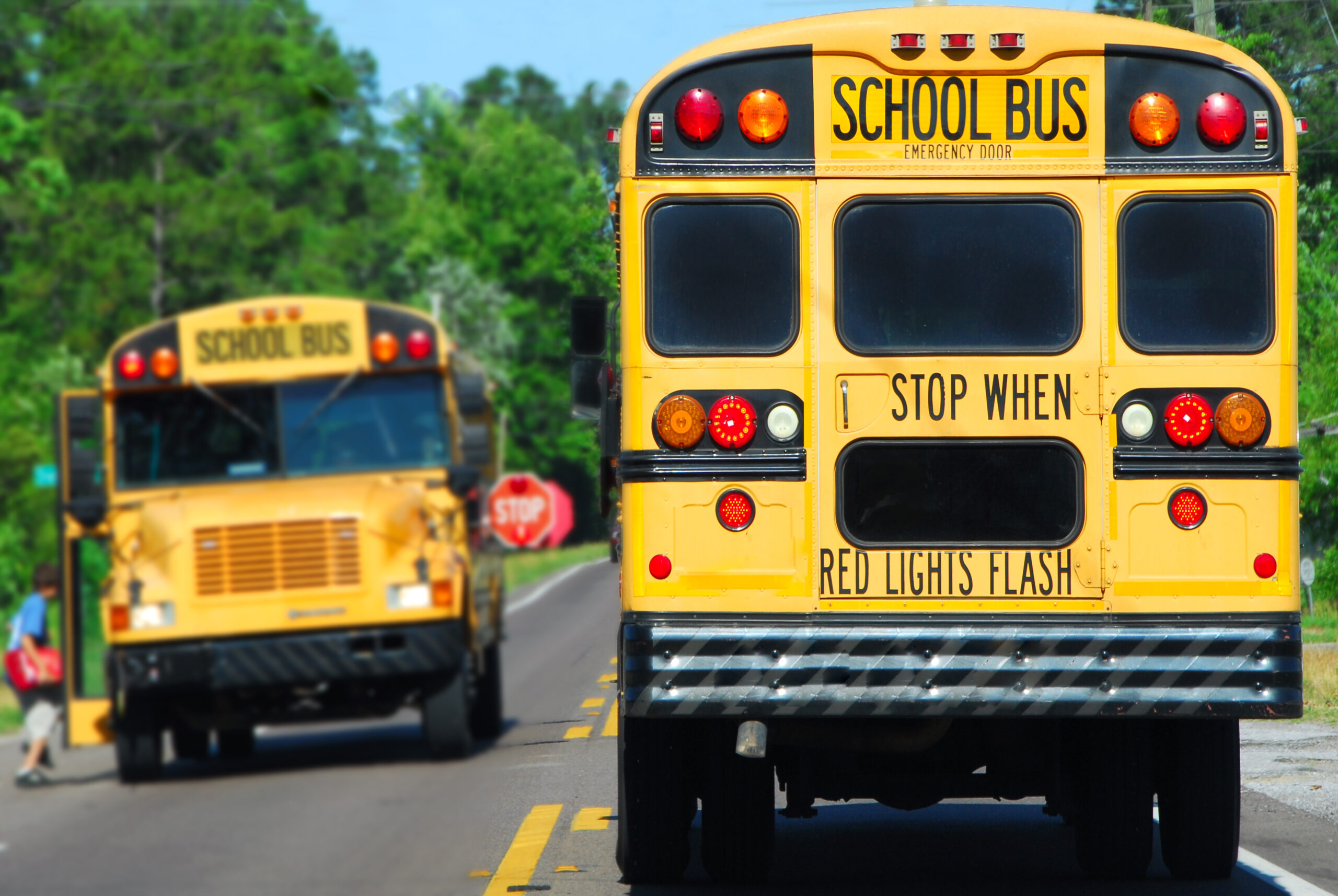school bus picking up kids in a school zone