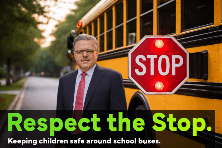 personal injury attorney and senior partner at Farah & Farah Chuck Farah at a school bus stop