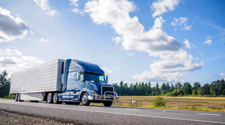 a semi truck driving along a highway
