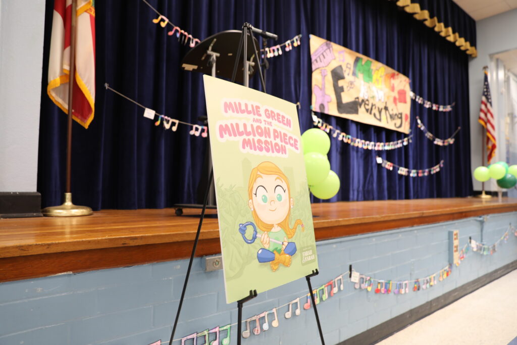 stage at Englewood Elementary School set up for launch of teacher Emily Smith's book Millie Green and the Million Piece Mission