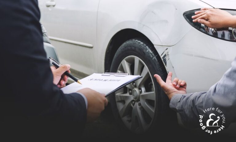 Car accident claimant showing an insurance adjuster damages to a white car after an accident