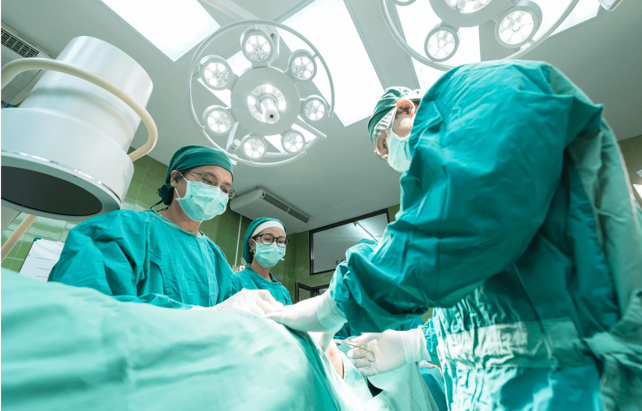 Group of surgeons operating on a patient